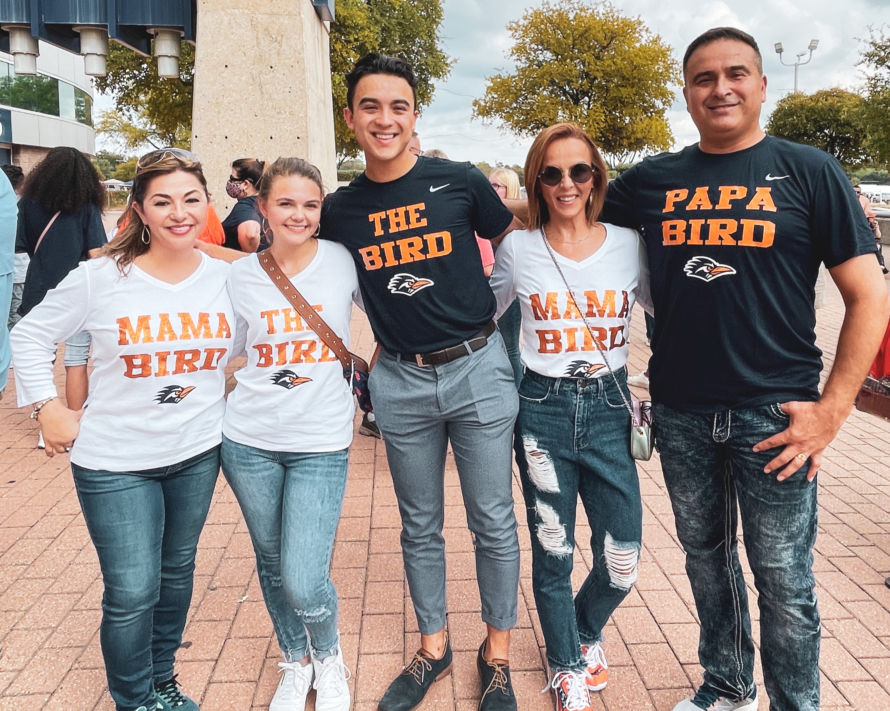 Family of five with UTSA family shirts.